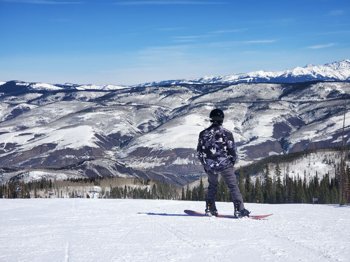 Snowboarding above a mountain valley